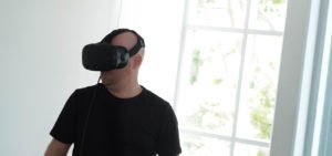 Photo of a person using augmented reality glasses | featured image for Virtual Reality.